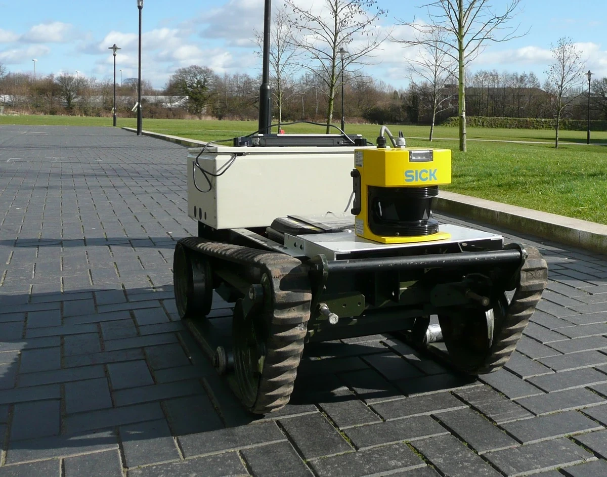 Mobile robot with a yellow lidar sensor mounted at the front