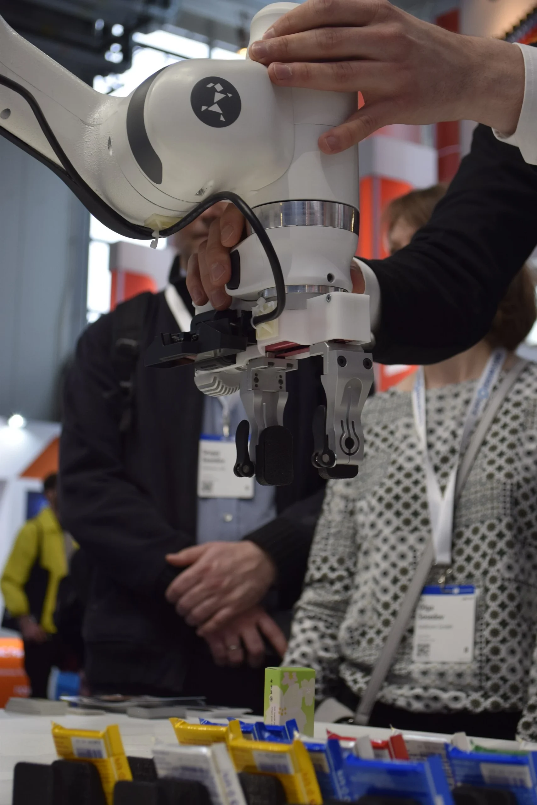 Person physically guiding a Franka robot arm during a demonstration