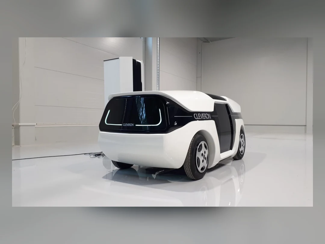 Cleveron autonomous delivery robot beside a personal parcel locker